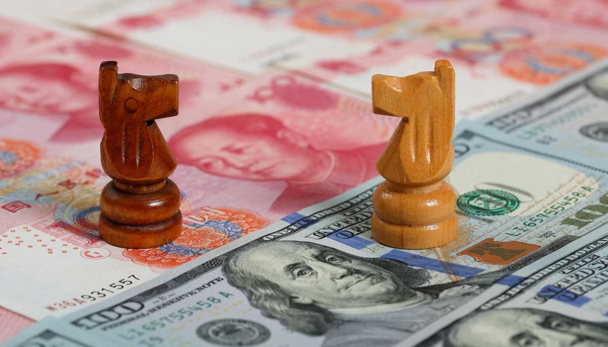 chess pieces on top of cash