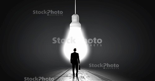 man in front of lightbulb